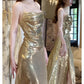 Superbe robe de soirée fendue à bretelles spaghetti et paillettes dorées C2682