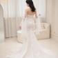 Robe de mariée sirène intemporelle sans bretelles en tulle avec appliques et manches longues C3831